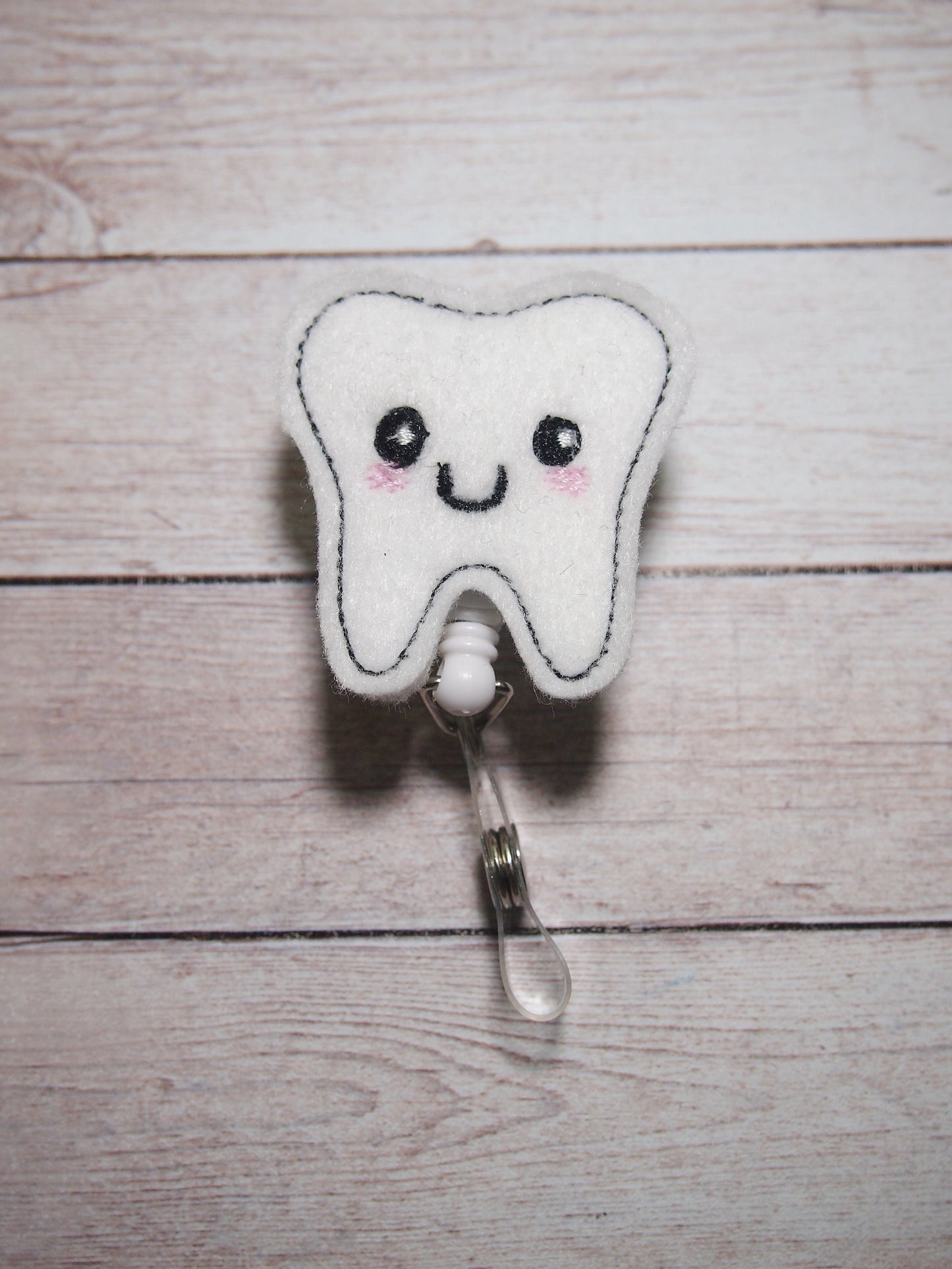 Tooth Badge Reel