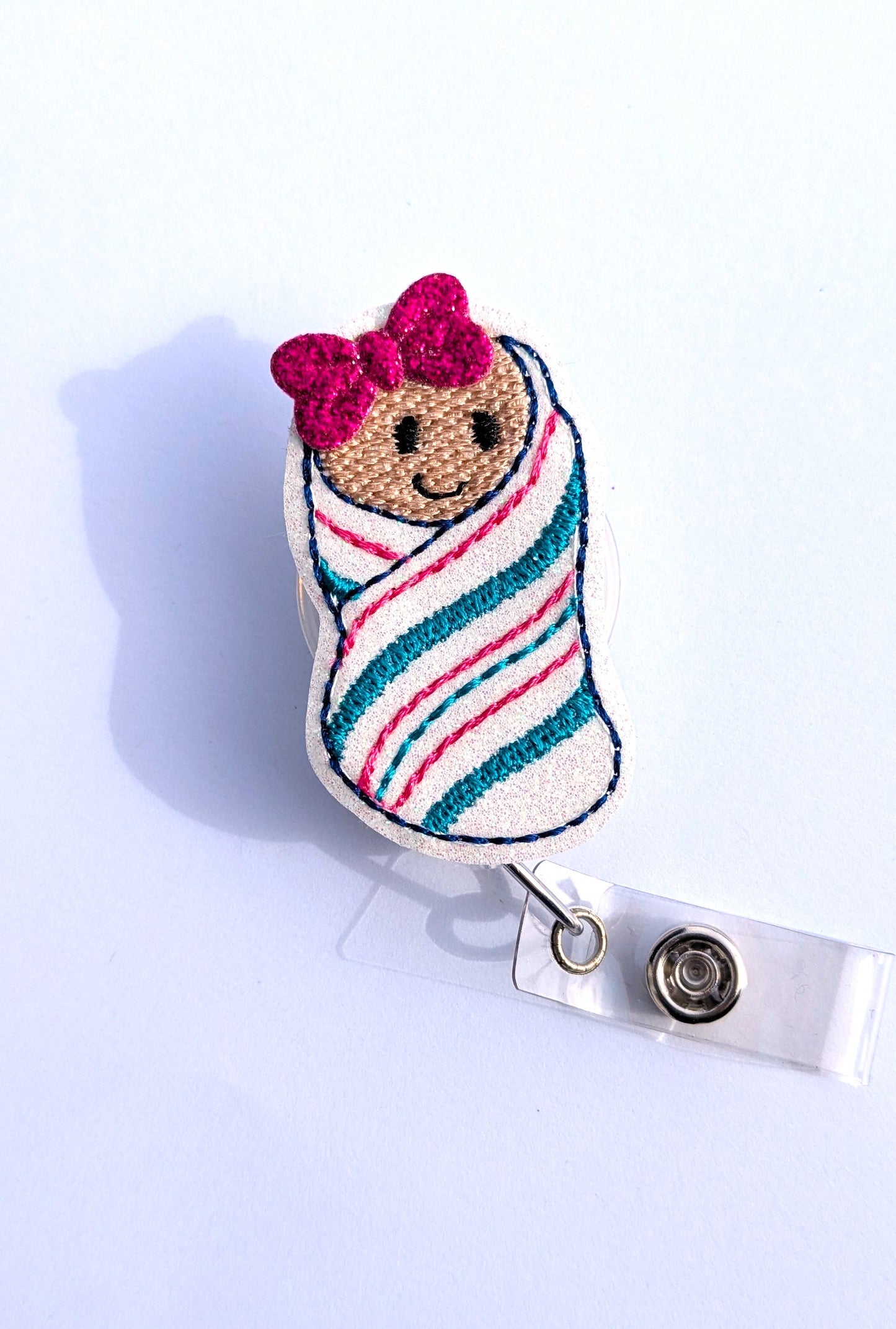 Newborn Baby Badge Reel with random bow on it's head
