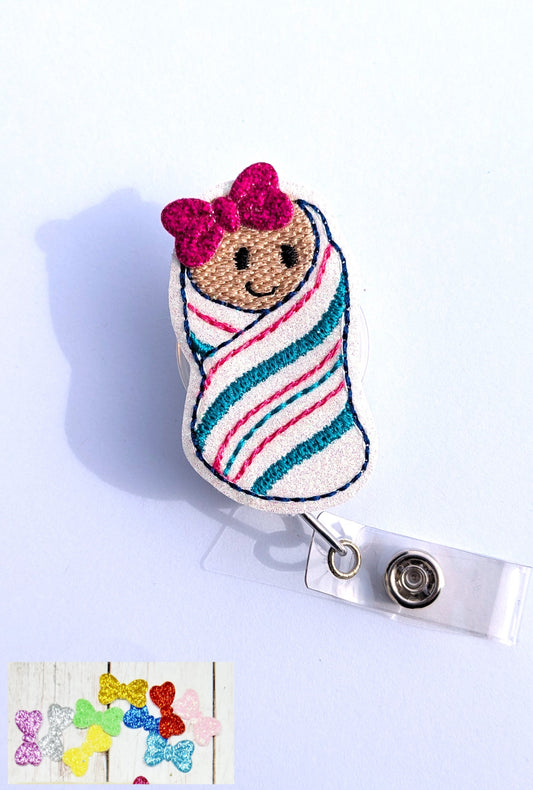 Newborn Baby Badge Reel with random bow on it's head