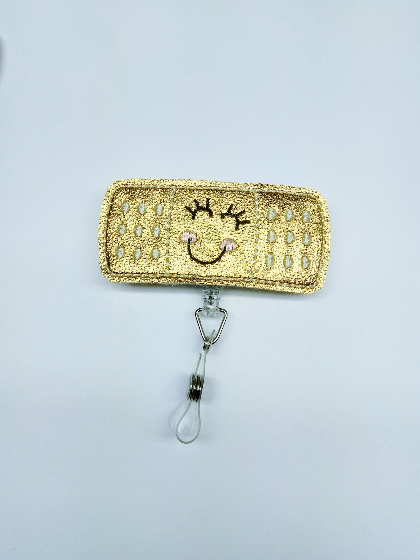 Shiny Gold Bandaid Badge reel